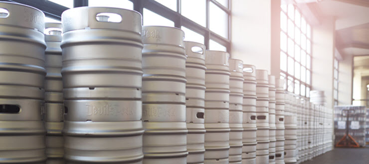 Multiple beer kegs in warehouse